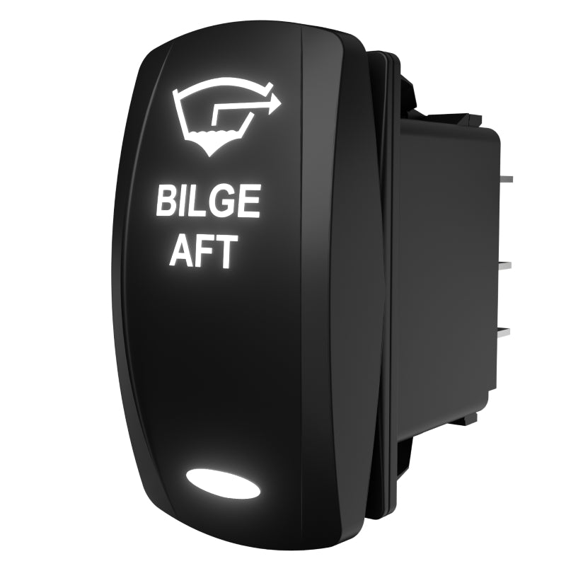Bilge Aft rocker switch (Carling), angled rear view showing backlit legend, exposed connector pins and mounting clip.