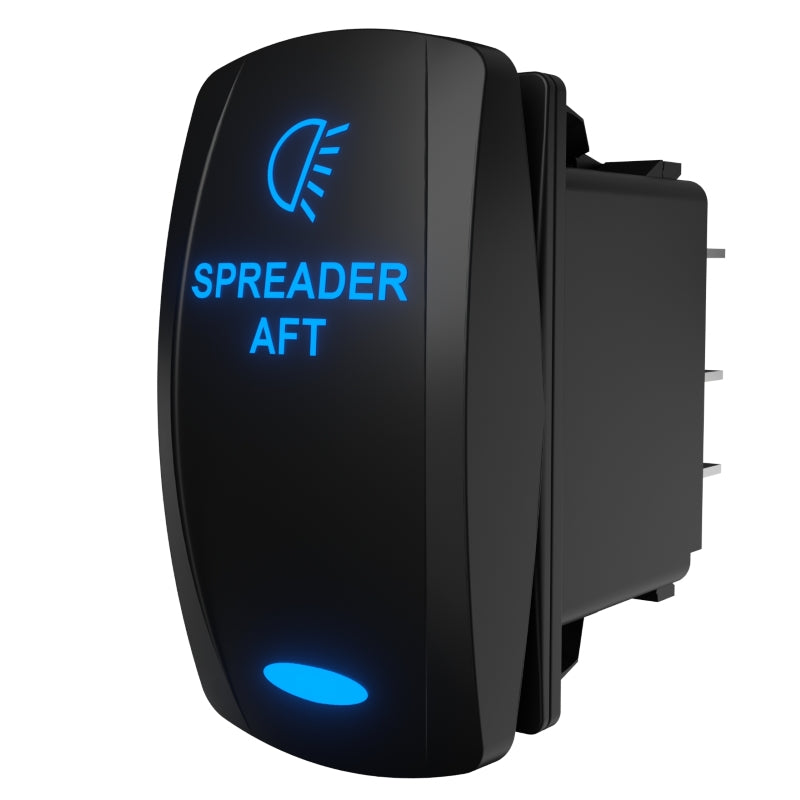 Angled rear view of backlit SPREADER AFT rocker switch showing blue legend, connector pins and mounting clip