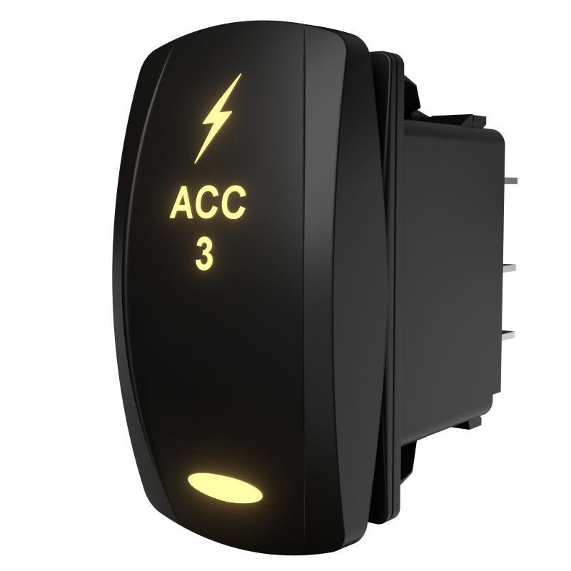 Carling ACC 3 illuminated rocker switch, angled rear-side view showing lit legend and exposed spade terminals
