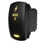 Carling ACC 3 illuminated rocker switch, angled rear-side view showing lit legend and exposed spade terminals