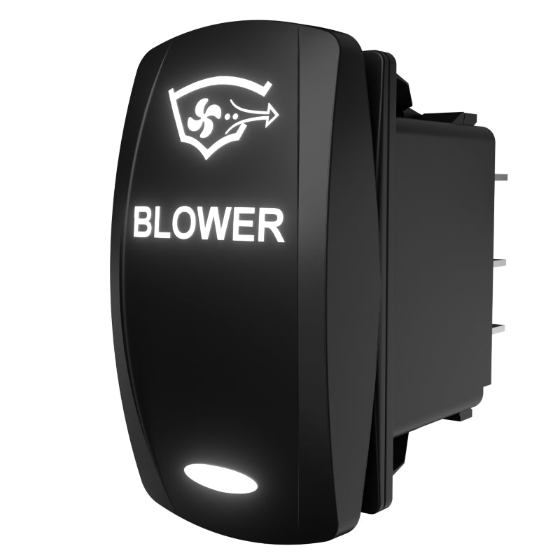 Carling Technologies blower rocker switch, angled rear-side view showing illuminated legend and terminal pins.