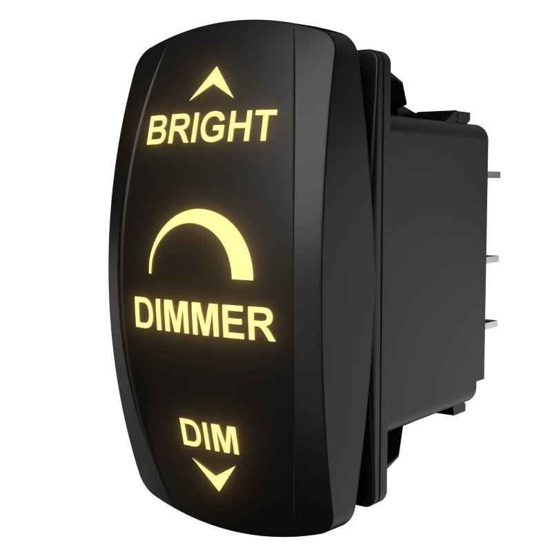 Carling Technologies dimmer, side/rear view showing illuminated front labels and exposed spade terminals.