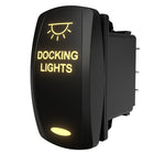 Angled front-right view of illuminated black rocker switch labeled DOCKING LIGHTS showing rear spade terminals