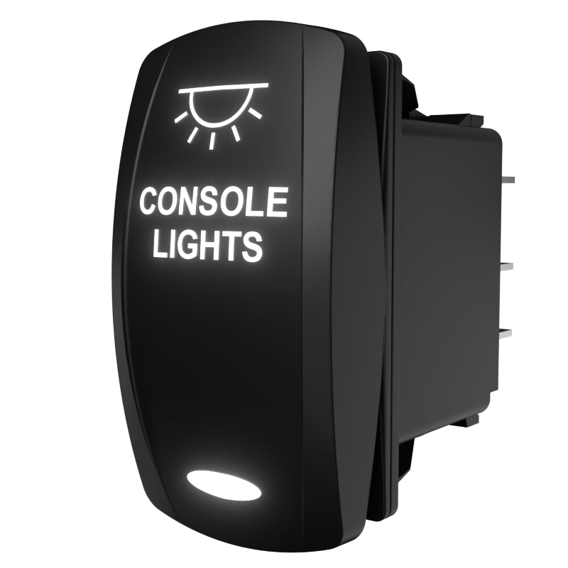 Carling console lights rocker switch, angled rear-side view showing spade terminals and illuminated label