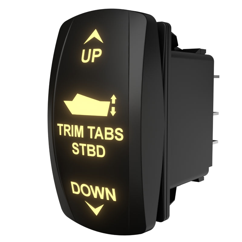 Angled rear-side view of illuminated starboard trim-tabs rocker switch showing connector pins and panel depth