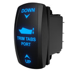 Angled front-right view of illuminated port trim-tabs rocker switch showing blue backlit labels and rear connector pins.