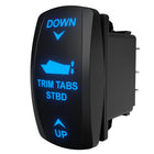 TRIM TABS STBD rocker switch angled side view showing illuminated blue legend and rear spade terminals.