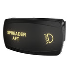 Front-right angled view of illuminated SPREADER AFT switch, showing headlight icon and connector.