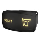 Angled front-right view of illuminated black toilet indicator switch showing the rear mounting clip
