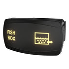 Front/angled view of illuminated macerator control rocker switch labeled "FISH BOX" with tank icon