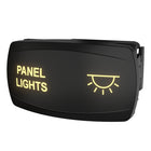 Rear-side angled view of panel lights switch showing illuminated legend, sun icon and mounting clip.