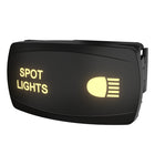 Angled front view of illuminated SPOT LIGHTS rocker switch showing amber text, icon and visible mounting housing