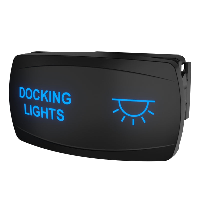 Angled side view of illuminated Docking Lights rocker switch showing blue legend and rear connector
