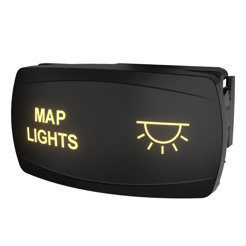 Angled front view of map lights rocker switch with yellow backlit legend and rear mounting clip visible