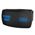 Carling Technologies flood light rocker switch, front-angle view with blue illuminated label and connector icon