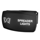 Angled view of illuminated rocker switch labeled SPREADER LIGHTS showing side connector and mounting clip