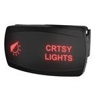 Front-angled view of courtesy lights rocker switch with red-lit 'CRTSY LIGHTS' legend and side mounting clip