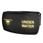 Angled front view of illuminated rocker switch labeled UNDER WATER with glowing icon and visible mounting clip