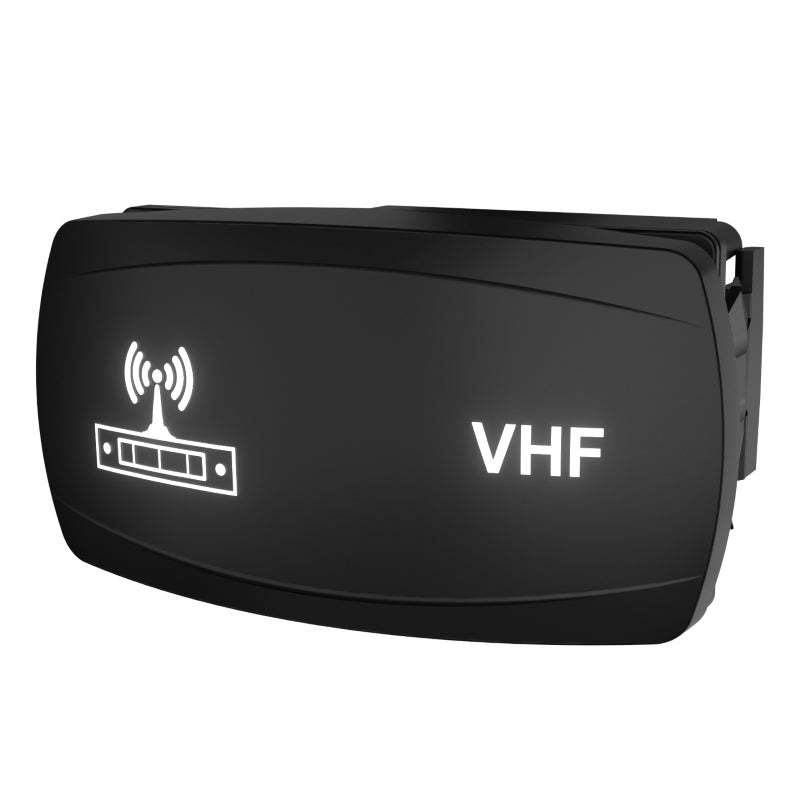 Angled front view of illuminated black VHF rocker switch faceplate showing antenna icon and VHF label