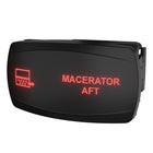 Carling Macerator Aft rocker switch, angled side view showing illuminated red label and rear mounting clip.