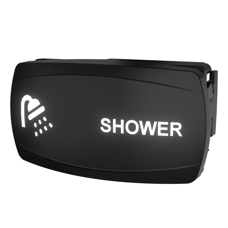 Angled side/rear view of illuminated black SHOWER rocker switch showing profile and right-side mounting clip