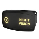 Carling Night Vision illuminated rocker switch, angled view showing lit legend and rear connector