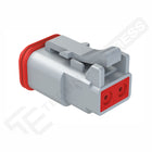 Amphenol AT06-2S female 2-way DT plug, angled front-side view showing connector face, latch and red rear seal