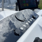Boston Whaler 18 Dauntless switch panel angled close-up showing round gauge, labeled push buttons and USB/12V cap