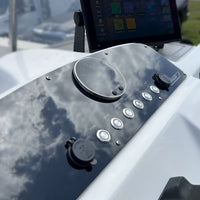 Boston Whaler 18 Dauntless switch panel angled close-up showing round gauge, labeled push buttons and USB/12V cap