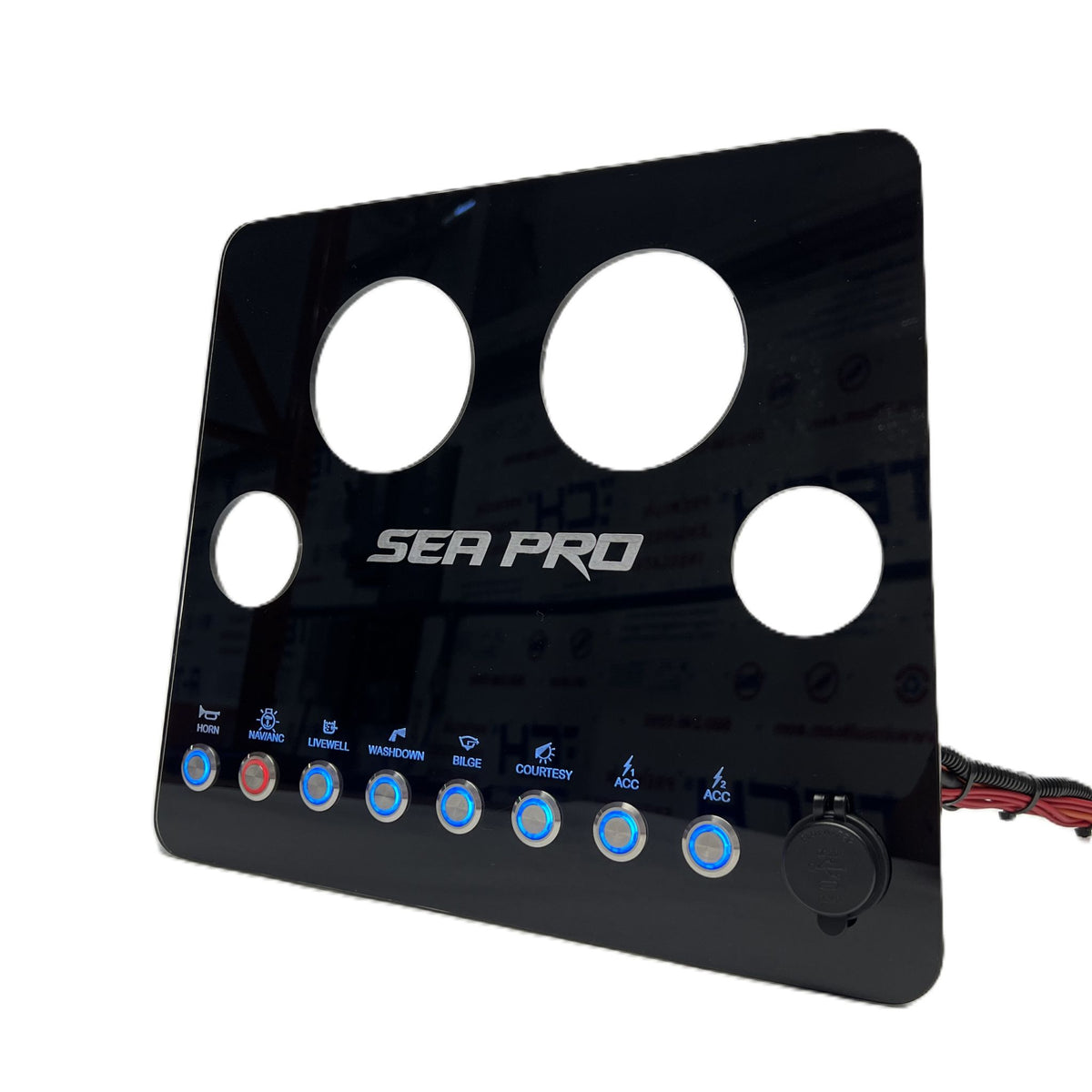 Angled right-side SeaPro dash panel showing circular gauge holes, backlit switches, wiring and power outlet.
