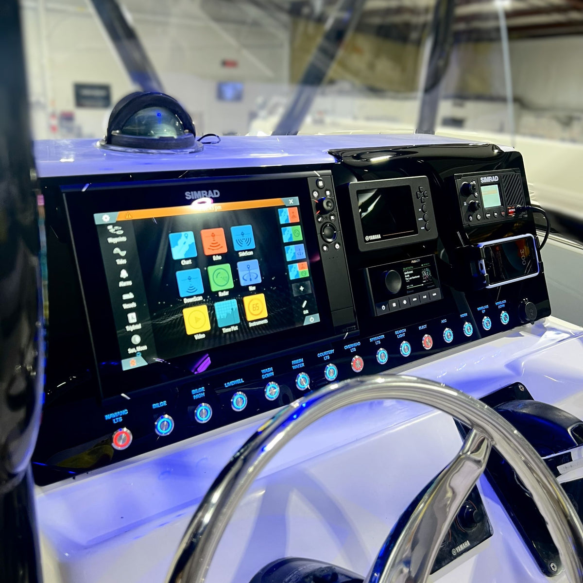 Replacement of the Key West 2300 dashboard panel with custom engraving on a boat.