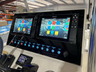 Front-angle view of Key West dash panel installed, showing dual Simrad displays and illuminated switches.