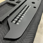 Typhoon 33CC dash panel angled close-up showing labeled switch strip, button caps and circular cutouts