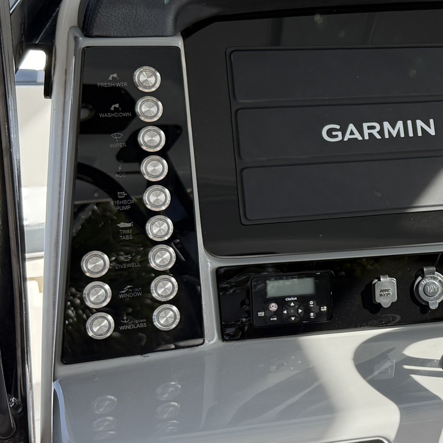 Robalo R272 Switch Panel with buttons and display on a boat dashboard.