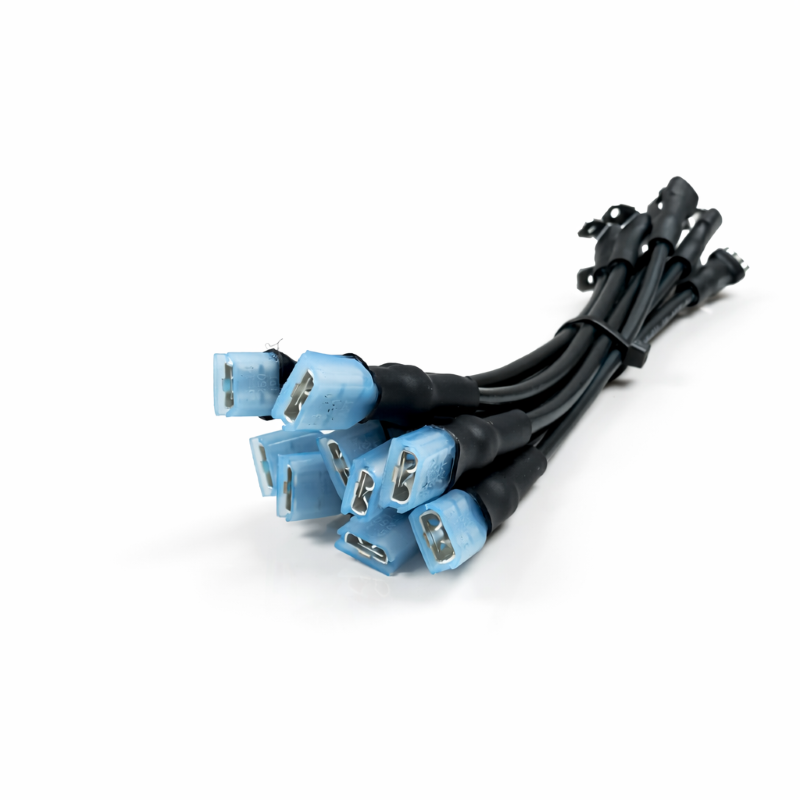 Angled close-up of 14 AWG marine jumper wires showing blue insulated female spade connectors and black leads